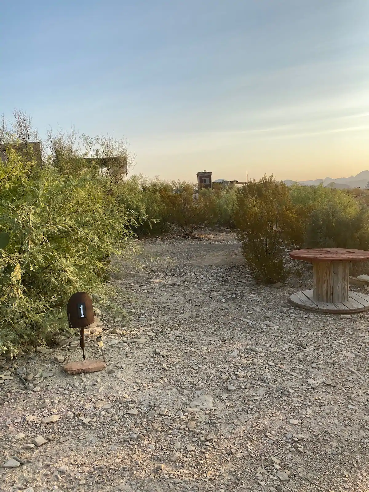 c77a9667-1da2-4435-bd7c-90010f784fb9 A small fire pit in the middle of an area.